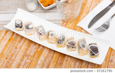 Appetizing herring fillet with onion on top 87261790