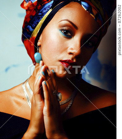 beauty bright african woman with creative make up, shawl on head like cuban woman beauty bright african woman with creative make up, shawl on head like cuban woman 87262002