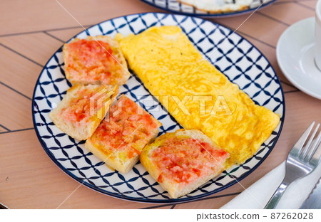 Stuffed french omelet with fresh baguette and sauce Stuffed french omelet with fresh baguette and sauce 87262028