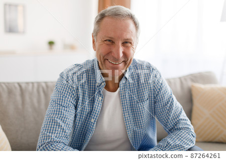 Mature man having rest at home on the couch Mature man having rest at home on the couch 87264261
