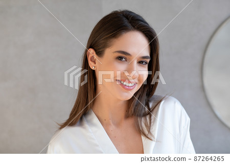 Closeup Portrait Of Beautiful Young Woman With Perfect Skin Looking At Camera Closeup Portrait Of Beautiful Young Woman With Perfect Skin Looking At Camera 87264265