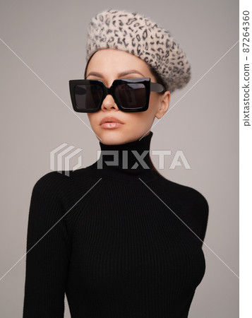 Beautiful young lady in a black turtleneck 87264360