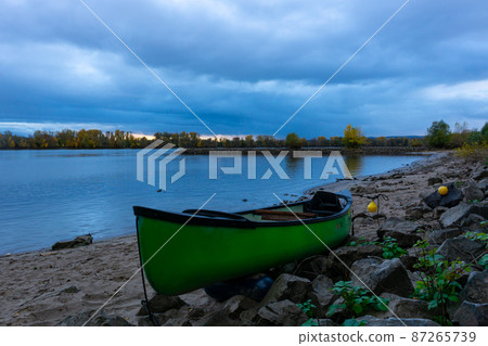 canoa on a beach on river Rhine 87265739