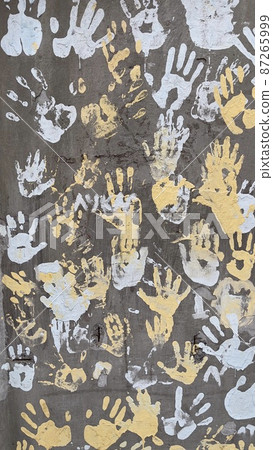 Children of Ukraine for peace, left footprints the wall Ukrainian flag Children of Ukraine for peace, left footprints the wall Ukrainian flag 87265999