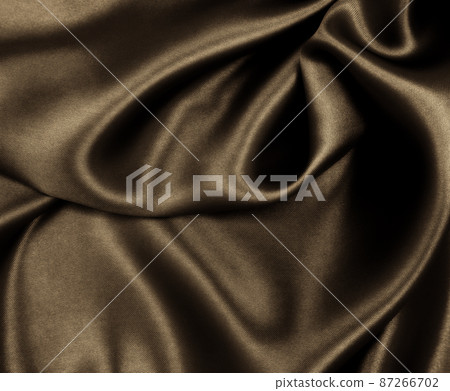 Smooth elegant brown silk or satin texture as abstract background. Luxurious background design. In Sepia toned. Retro style 87266702