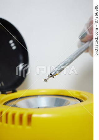 piercings on an ear. Conch and helix piercings close up. 87266986