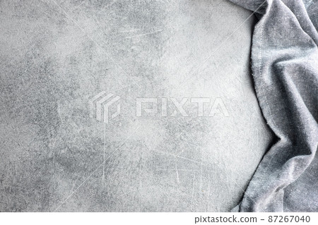 Kitchen table background with gray napkin. 87267040