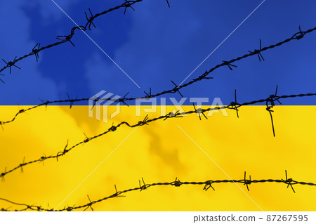 Uprisen view of metal barbed wire fence over Ukraine flag. Stop war. Pray for Ukraine Uprisen view of metal barbed wire fence over Ukraine flag. Stop war. Pray for Ukraine 87267595