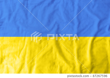 Ukraine flag with fabric texture. Flag symbols of Ukraine country. No war. The national yellow and blue flag Ukraine flag with fabric texture. Flag symbols of Ukraine country. No war. The national yellow and blue flag 87267596