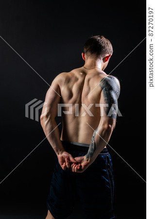 Man on black background keeps dumbbells pumped up in fitness bodybuilding biceps sport, athlete weight workout athletic dumbbell, male Lift sportive guy fit back of the arm muscles Man on black background keeps dumbbells pumped up in fitness bodybuilding biceps sport, athlete weight workout athletic dumbbell, male Lift sportive guy fit back of the arm muscles 87270197