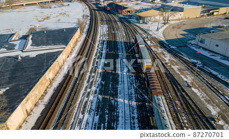 Winter railyard with snow during the day 87270701