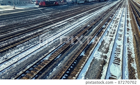 Winter railyard with snow during the day 87270702