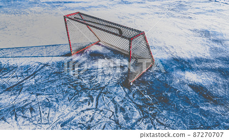 Matte effect with Hockey stick on top of ice arena net Matte effect with Hockey stick on top of ice arena net 87270707