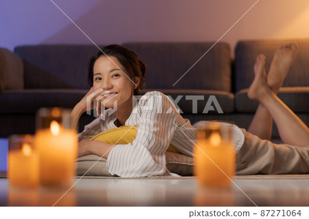 A woman relaxing at home 87271064