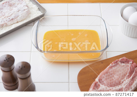 Tonkatsu pork loin preparation beaten egg 87271417