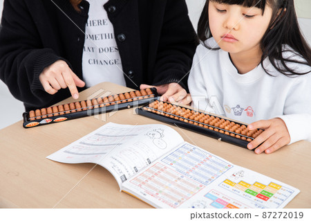 Mother and daughter learning abacus homework Mother and daughter learning abacus homework 87272019