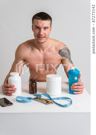 Fitness protein jars white on white background bodybuilder powder strong high ache sore injury, backache sick caucasian health medicine, muscular expression. Tension red care, back suffer attractive 87273142