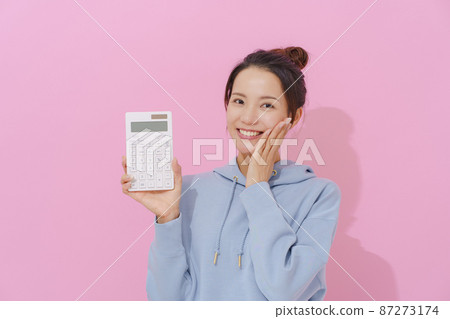 Woman with a calculator Woman with a calculator 87273174