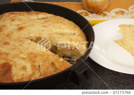 Homemade pastries in a cast-iron pan apple pie simple recipes cooking European cuisine Homemade pastries in a cast-iron pan apple pie simple recipes cooking European cuisine 87273766