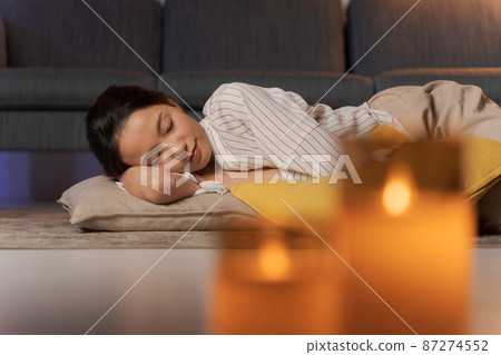 A woman relaxing at home at night 87274552