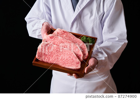 Japanese black beef loin steak Itamae holding meat in hand Japanese black beef loin steak Itamae holding meat in hand 87274900