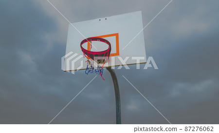Matte on low angle basketball hoop with moody sky Matte on low angle basketball hoop with moody sky 87276062