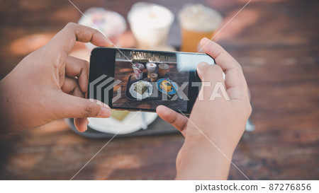 Woman Hands Taking Photographs Foods on Her Mobile Phone, Customer Woman Using Smartphone Take a Picture Food for Sharing Her Friends in Cafe and Restaurant Shop. Technology Digital Smart Phone Woman Hands Taking Photographs Foods on Her Mobile Phone, Customer Woman Using Smartphone Take a Picture Food for Sharing Her Friends in Cafe and Restaurant Shop. Technology Digital Smart Phone 87276856