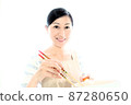 A middle-aged woman who cooks in an apron, a woman who cooks with a smile 87280650
