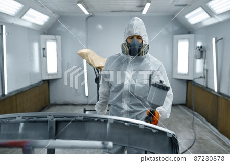 Painter in protective mask painting automobile part Painter in protective mask painting automobile part 87280878