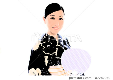 A woman wearing an indigo-dyed yukata and holding a uchiwa A woman wearing an indigo-dyed yukata and holding a uchiwa 87282040