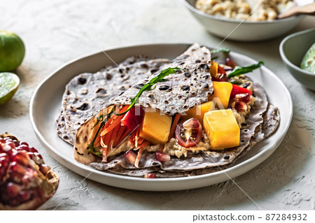 Mango Rocket and Pomegranate in Sweet Purple Potato Tortilla 87284932