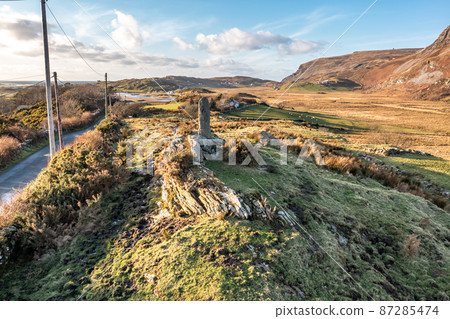 Aerial view of standing stone in Glencolumbkille in County Donegal, Republic of Irleand Aerial view of standing stone in Glencolumbkille in County Donegal, Republic of Irleand 87285474