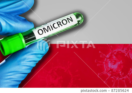 Poland outbreak of omicron variant. Hand holds a test tube with covid-19 virus omicron in front of Poland flag 87285624