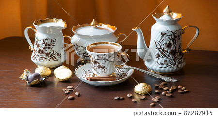 Sweets on the background of coffee still life Sweets on the background of coffee still life 87287915