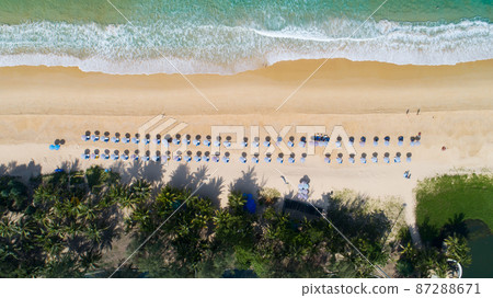 Aerial view top down of Coconut palm trees on the beautiful Karon beach Phuket Thailand Amazing sea beach sand tourist travel destination in the andaman sea Beautiful island 87288671