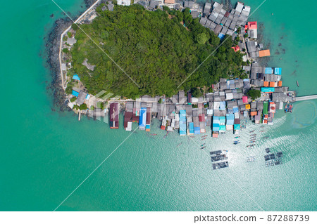 Aerial view top down of small island in tropical sea with small bridge to the island located koh rat suratthani Thailand Aerial view top down of small island in tropical sea with small bridge to the island located koh rat suratthani Thailand 87288739