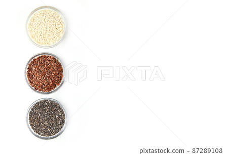 Chia, flax, sesame in glass bowls isolated on white background 87289108