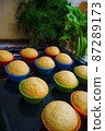 Cool freshly baked vanilla muffins on a metal sheet. 87289173