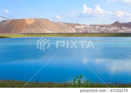 Soligorsk mountains. potash plant. Potash mountains near Soligorsk City. salt lake 87289279