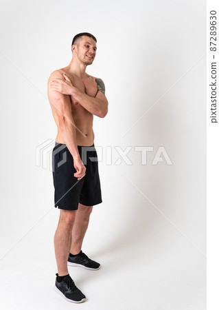 A sore shoulder joint muscle in a white man on a white background back body muscle, backache sick massage adult, illness chronic. Hold lumbar disease suffer attractive A sore shoulder joint muscle in a white man on a white background back body muscle, backache sick massage adult, illness chronic. Hold lumbar disease suffer attractive 87289630
