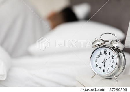 Wake Up Time. Vintage Alarm Clock Standing On Bedside Table In Bedroom 87290206