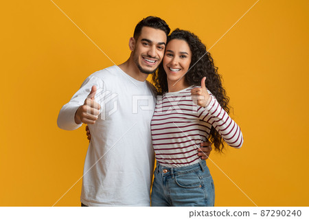 All Is Great. Positive Middle Eastern Couple Gesturing Thumbs Up At Camera 87290240