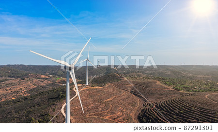 Aerial view wind turbine eco friendly renewable energy concept on Portuguese mountains background. Sunny day Aerial view wind turbine eco friendly renewable energy concept on Portuguese mountains background. Sunny day 87291301