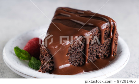 Slice of chocolate brownie cake with chocolate glaze Slice of chocolate brownie cake with chocolate glaze 87291460