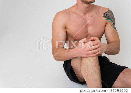 A man's kneecap hurts on a white background ache body cramp sick isolated health stress, human Hold neck disease suffer attractive 87291692