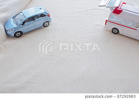 Ambulance and car colliding with a wall 87292063