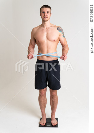 Man with weights health pondered, health and sports on a white background ache sore painful, backache spine isolated young stress, human neck care, ain suffer attractive Man with weights health pondered, health and sports on a white background ache sore painful, backache spine isolated young stress, human neck care, ain suffer attractive 87296031