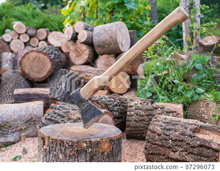 Photography on theme big steel axe with wooden handle Photography on theme big steel axe with wooden handle 87296073