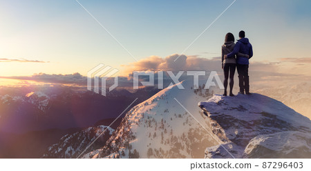 Man and Woman Standing Together enjoying the beautiful landscape view. 87296403