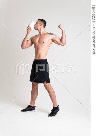 Fitness protein jars white on white background bodybuilder powder strong high ache hurt injury, backache person male health medical, muscular holding. Touching lumbar disease suffer attractive Fitness protein jars white on white background bodybuilder powder strong high ache hurt injury, backache person male health medical, muscular holding. Touching lumbar disease suffer attractive 87296493
